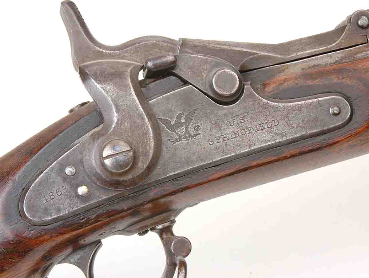 A source of confusion was that locks made for Civil War muzzleloading muskets were used in all .50 Government trapdoors. This one is marked 1863 while the breechblock is stamped 1868.